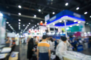 Abstract people walking in exhibition blurred background